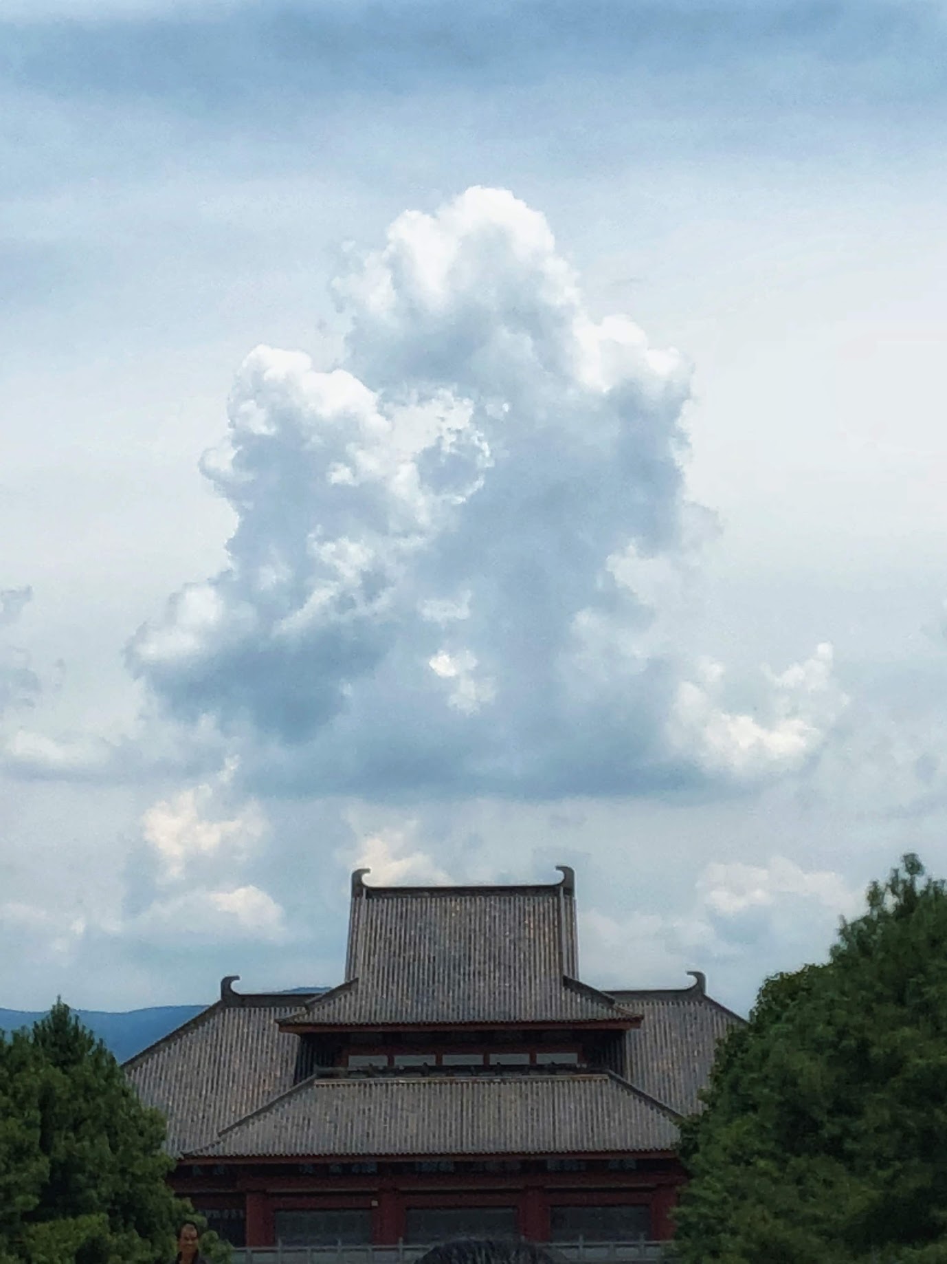 Traditional building under summer clouds in Yunnan